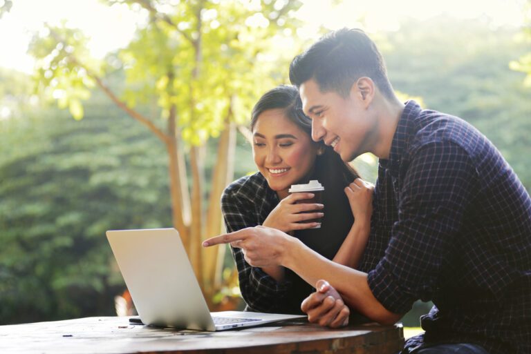 A couple looking at a laptop